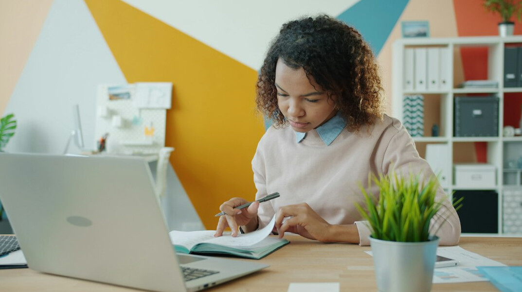 person calculating monthly budget at desk