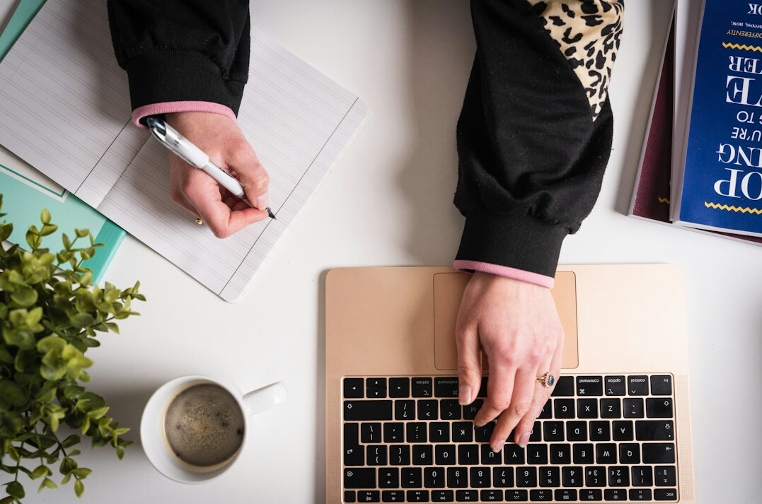 person planning budget on laptop