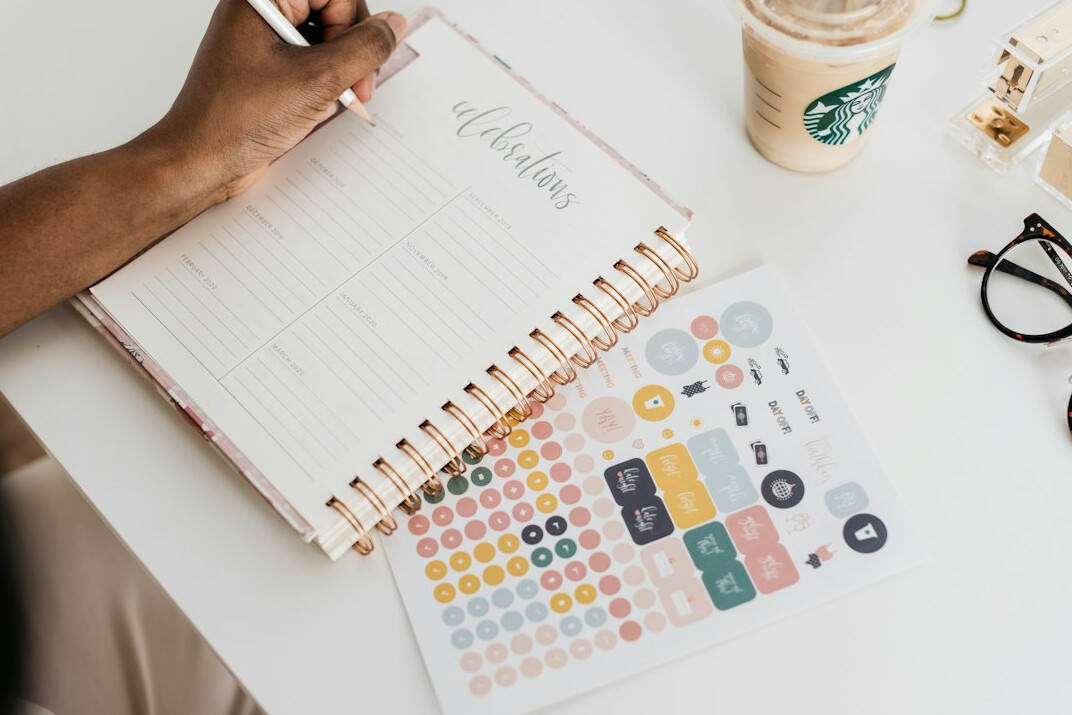 person calculating monthly budget at desk